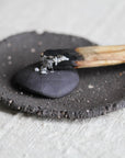 smudging dish for palo santo and sage. raw black clay. zen, minimalistic stylish incense smudge plate